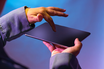 Pointing finger onto upward position digital tablet. Digital technology for business and marketing.