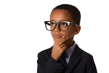 Elegant little boy with glasses in business suit. Studio shot. Isolated