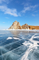 Lake Baikal in March. The natural landmark of the island of Olkhon is the Shamanka Rock on a sunny...