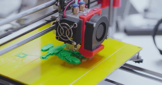 3d printer in process of creating mini robot