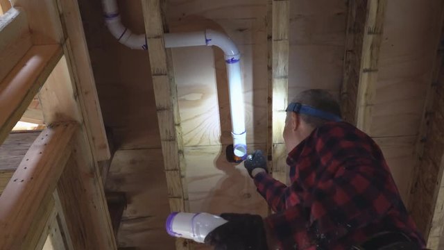 Plumber glued plastic toilet white tubes pipe together