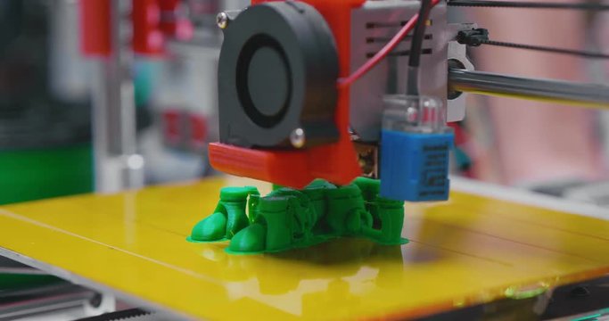 Automatic 3d printer performs product creation.