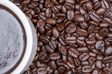 Cup of turkish brewed and whole bean organic smooth medium dark roast coffee from Sumatra on burlap background.