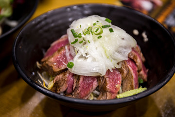 Grilled beef steak, rice, wasabi in the bowl