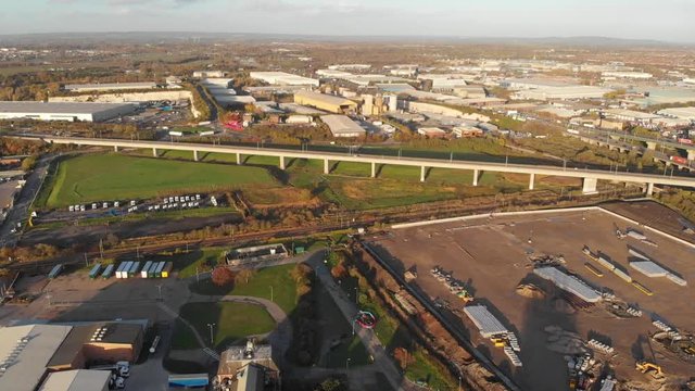 An aerial view of an industrial area near Dartford Crossing tunnel and Queen Elisabeth II bridge at sunset