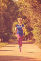 young female runner training for marathon