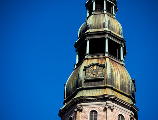 Tower clock of the famous St. Peter Church, Old town, Riga, Latvia