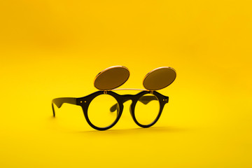 Sunglasses with double glass on a yellow background