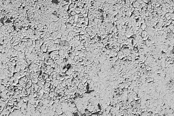 white peeling paint on the old rough concrete surface. black and white view