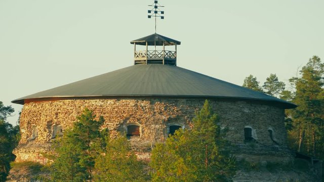Aerial pan of historic coastal fortress with stone walls, firing lines for artillery and a lookout post on top, Fredriksborg fortress on V&radic;&sect;rmd&radic;&part; island in the Stockholm Archipelago, nowadays a museum.