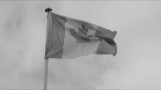 Slow Motion Canadian flag waving in the wind | 4K - VINTAGE STYLE - BLACK AND WHITE - PROJECTOR - SLOW MOTION - SLOMO