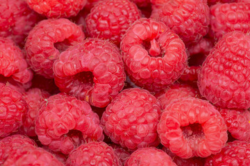 Macro shot of ripe organic raspberries like art texture, background