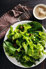 Plate green salad wooden table Healthy dietary food top view