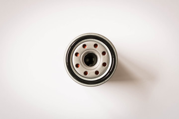 New car oil filter isolated on white background . Close up. Top view