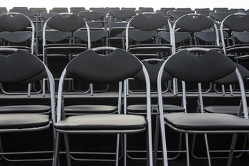 Empty metal black seats row.