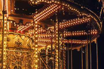 Lightened red and yellow night carousel.