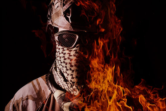 Military soldier portrait in fire.