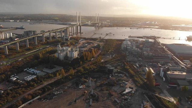 An aerial view of the traffic on the Queen Elisabeth II bridge at sunset
