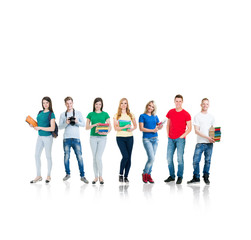Obraz premium Large group of smiling friends staying together and looking at camera isolated on white background.
