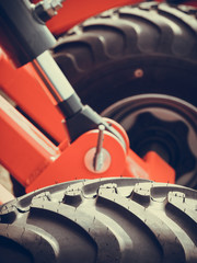 Detailed closeup agricultural machinery, big tires