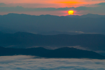  sunset overlooking mountains with Mist