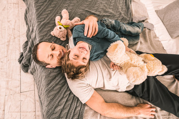 Beautiful family having a moment of relaxation after an energetic game.