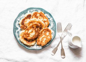 Potato fritters - delicious breakfast, snack on a light background, top view