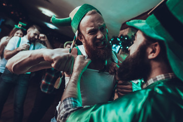 Drunk men fighting in a Saint Patrick's Day at pub