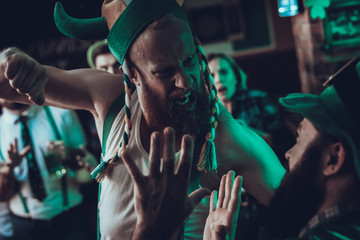 Drunk men fighting in a Saint Patrick's Day at pub