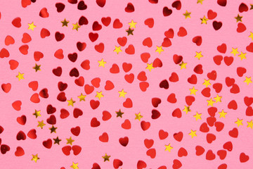 Pink background with red confetti hearts for Valentine Day