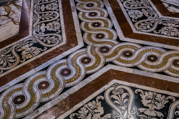 ancient marble carvings on the floor of Siena cathedral