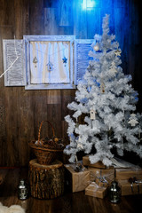 Winter background.Merry Christmas and happy New Year greeting card.Christmas tree with  decorations  and blue light