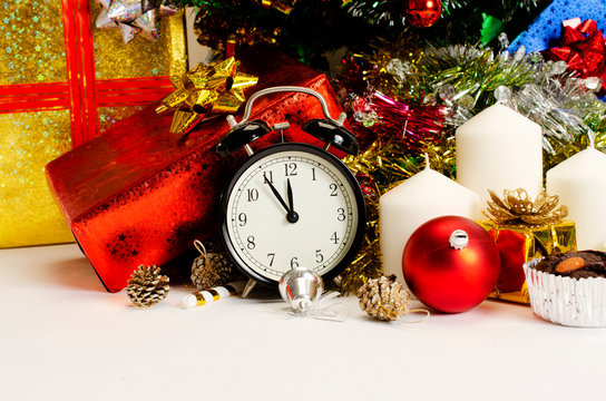 Christmas decoration with colck and gift box and candle on white backgrounds