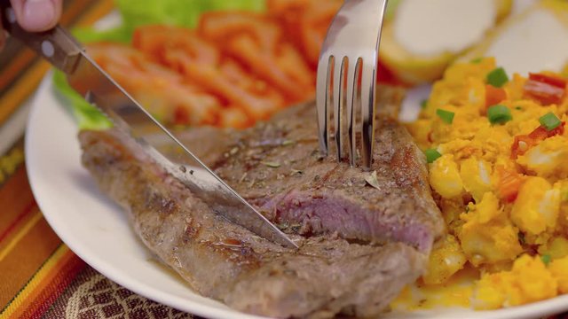 Meat Steak with corn tomatoes, lettuce and potatoes