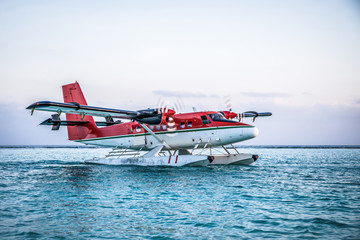 Seaplane. The takeoff of a seaplane from the ocean beach.