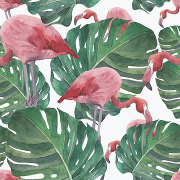 Seamless of pink flamingos and exotic leaves. Watercolor illustration.