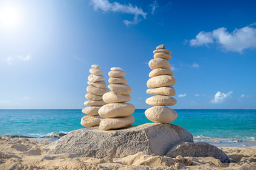 Stacks of stones in balance at a beach