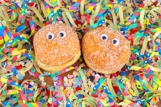berliner, krapfen, food for carnival with funny eyes and streamers