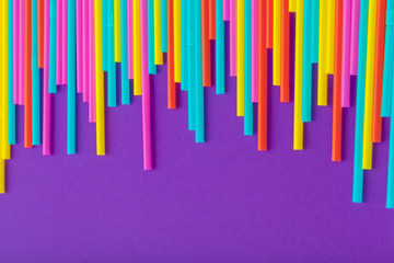 Colorful straws for beverage soft drink on colored background