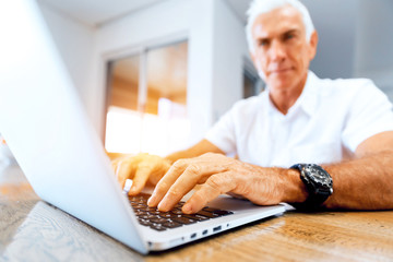 Man working on laptop at home