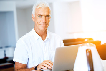Fototapeta premium Man working on laptop at home