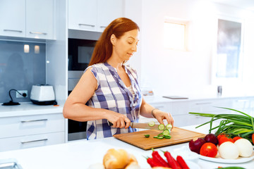 Beautiful woman standing in the kitchen