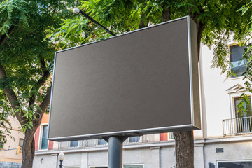 Outdoor billboard with natural landscape mockup © sdecoret