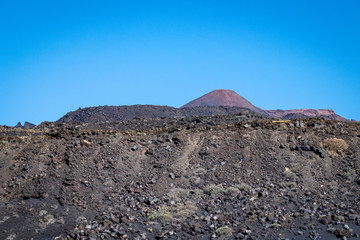 Edge of lava field and looking towards Teneguia Volcano, La Palma Island, The Canaries. Teneguia volcano last erupted in 1971