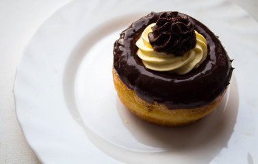 a delicious rum cake with chocolate and butter cream on a plate