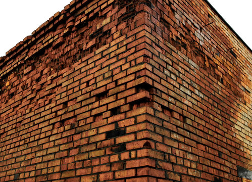 Brick wall corner. Brick walls. Collapsing brick building. Architectural background