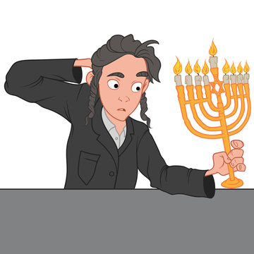 Young jewish boy celebrating Hanukkah, holding the golden menorah