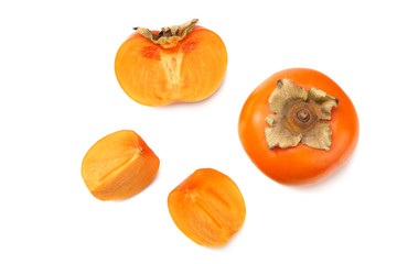 fresh ripe persimmons with slices isolated on white background. top view