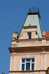 Fototapeta na wymiar Pediment of a building typical of Prague, Czech Republic