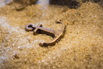 Metal anchor in the sand